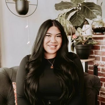 Cosmetologist and esthetician, Katrina,  smiling