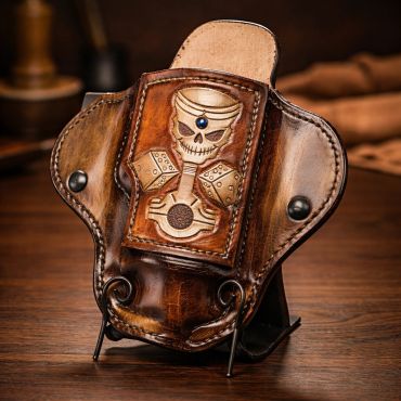 Leather phone holster with skull and dice design.