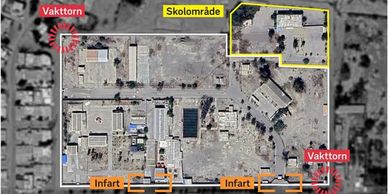 Aerial view of a school area labeled with security towers and entrances.