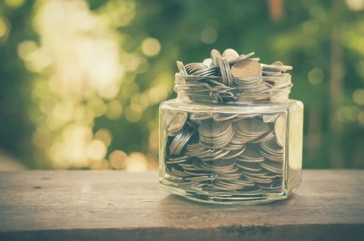 photo of jar with coins