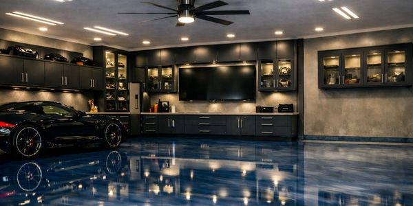 Organized garage workspace with metallic floor, cabinets and tool storage in Eagle, ID