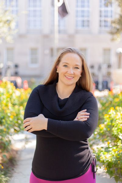 Smiling female attorney standing in front of the courthouse in Houma, Louisiana