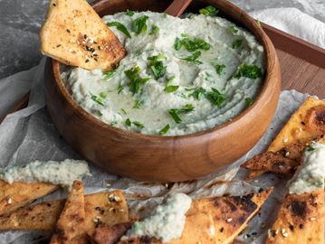 Dipping pita in chutney