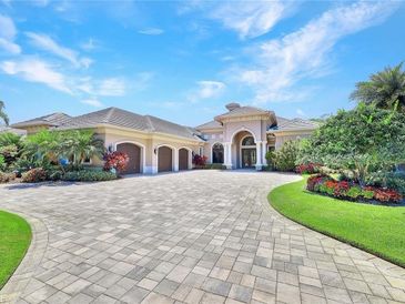 Luxurious house with a spacious driveway and well-kept gardens.