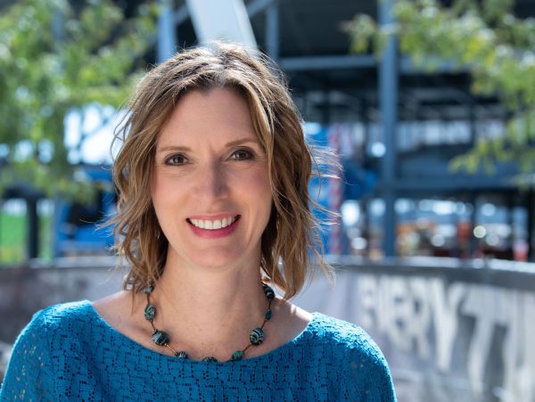 Professional portrait of Kim Sheldon, founder of PROPOSALand.