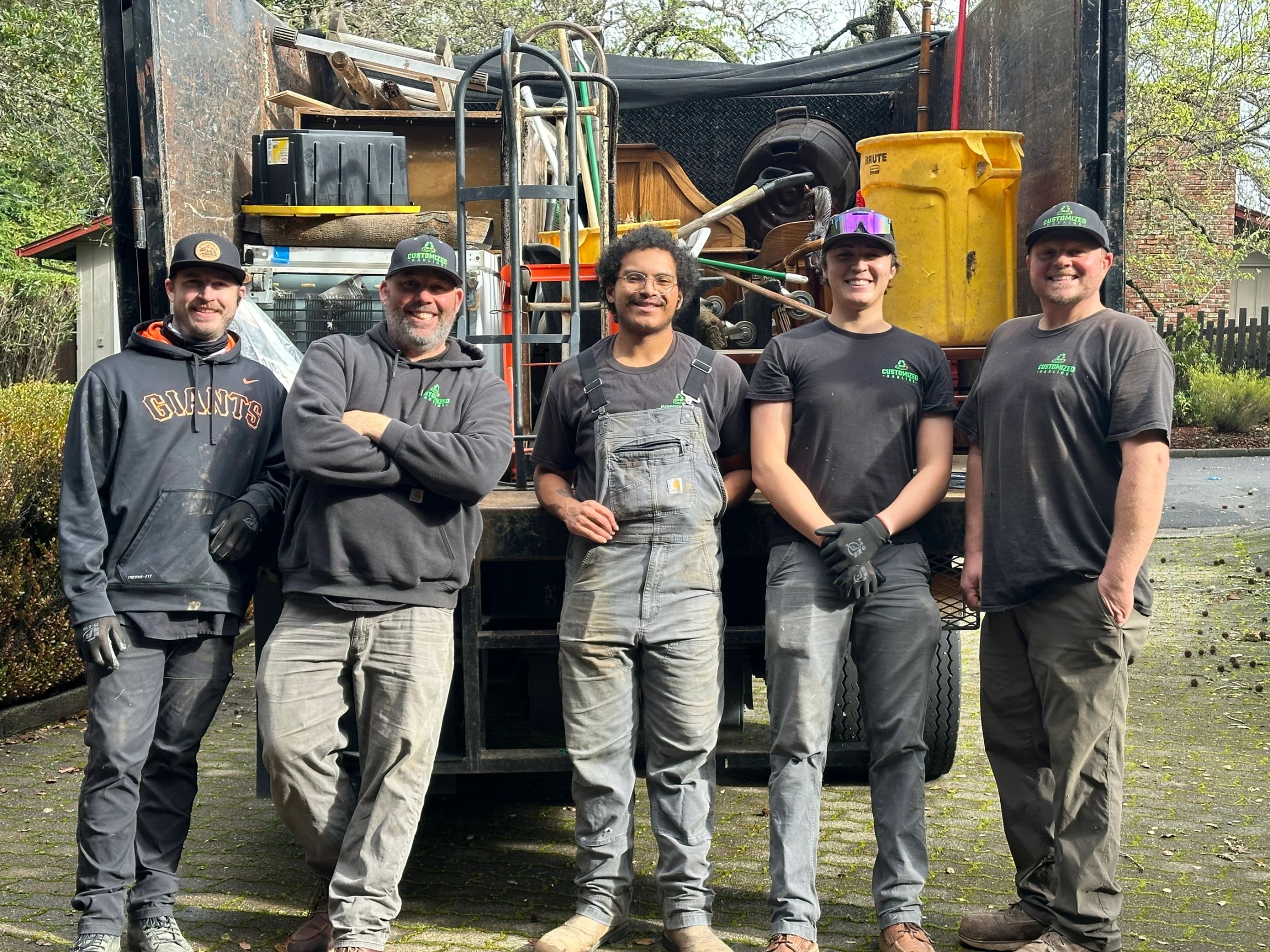 Customized Hauling junk removal team on the job