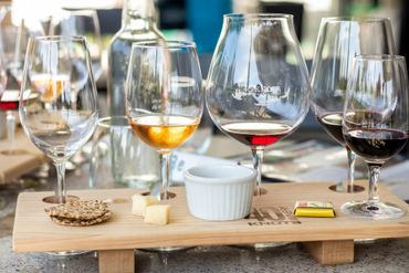 wine sampling with a custom cedar four wine glass holder