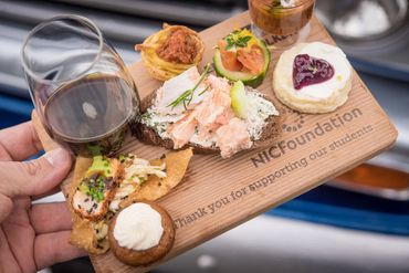 red wine in a wine appetizer plate with Hors d'Oeuvres