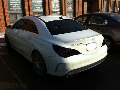 tinted taillights on white car in toronto