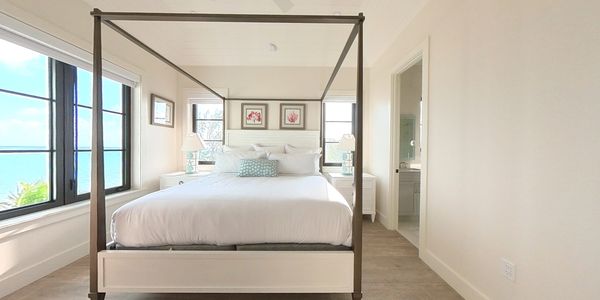 Seaside bedroom with four post bed
