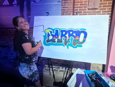 Pregnant woman painting graffiti art.