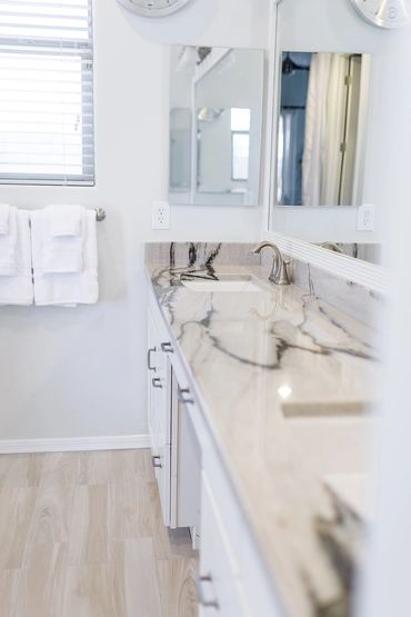 bathroom interior with white cabinets