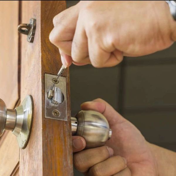 locksmith repairing the lock