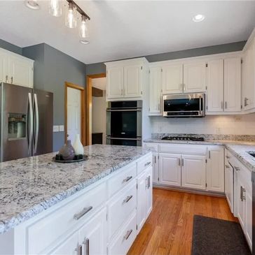 Updated Kitchen with white cabinets & granite countertops