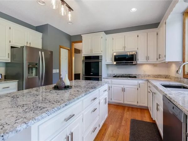 Modern kitchen with white cabinets and granite coutertops