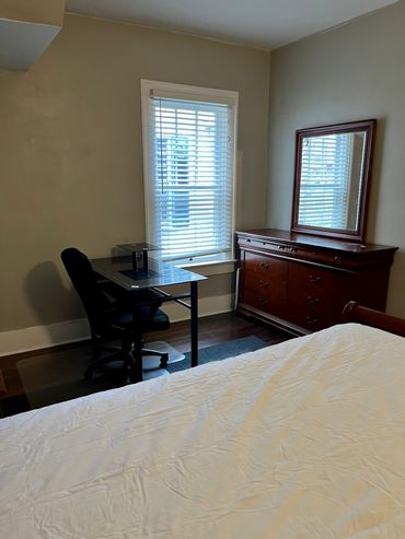 *Room 1 Bed,  desk with chair, window, dresser with mirror