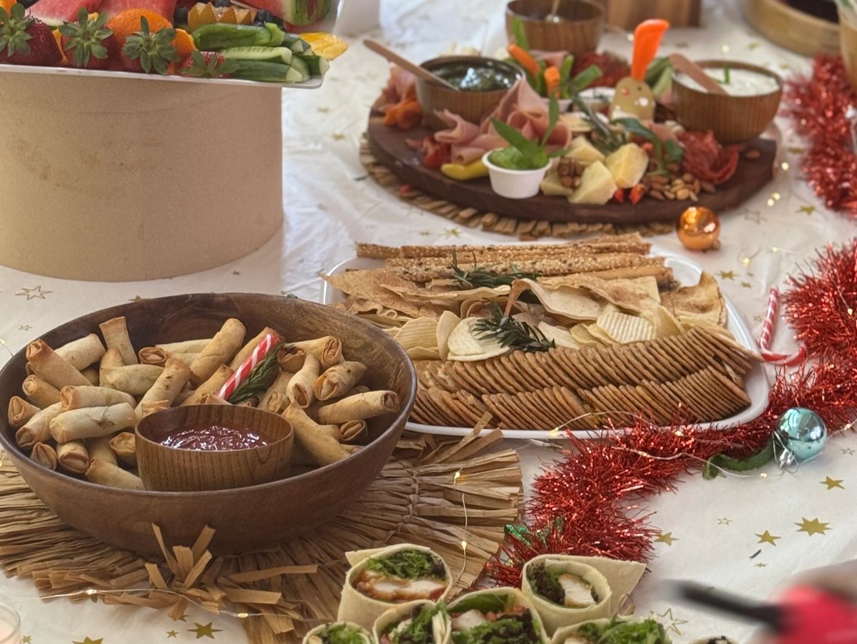 A festive table with assorted appetizers and snacks beautifully arranged.