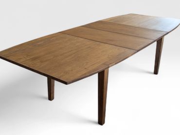 Extendable wooden dining table with a smooth finish.