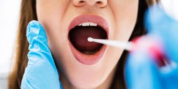 Close-up of oral swab test.