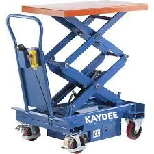 Blue industrial scissor lift table with wheels.