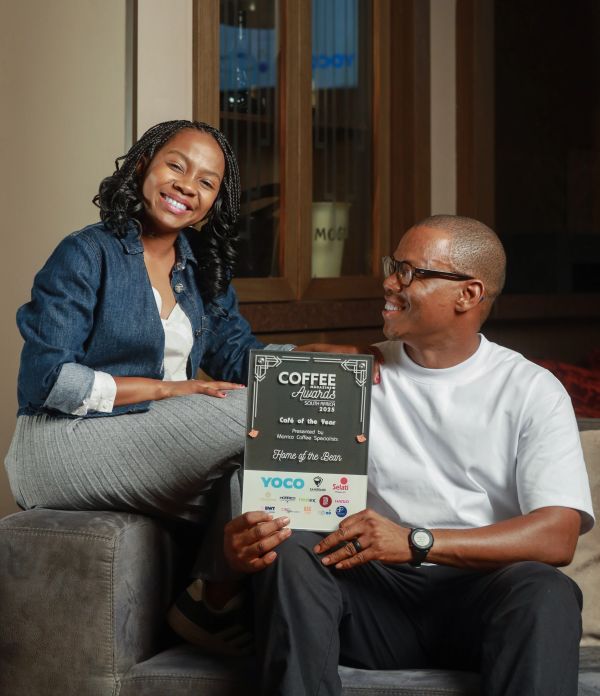 Happy couple with Coffee Magazine Awards 2025 plaque.