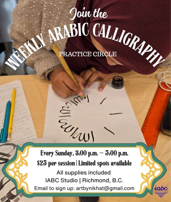 A person practicing Arabic calligraphy with a pen and ink.