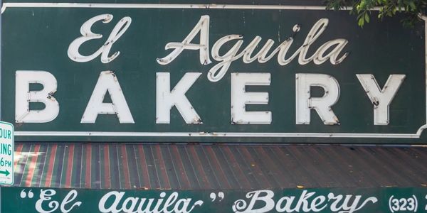 Photo of the El Aguila bakery sign in front of the store