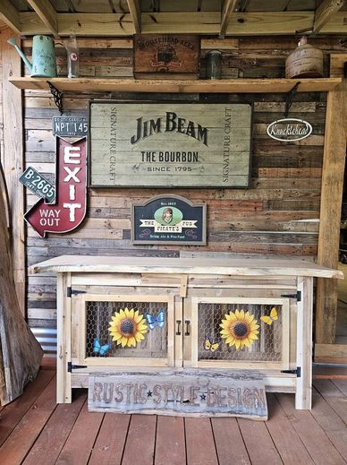 Rustic wooden decor with vintage signs and sunflower cabinet doors.