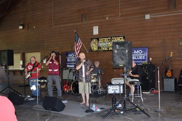 Buddha Blue Blues Band  performing 
at the Mo Blues Blues in The Park event  held at the Jefferson C