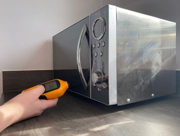 Portable appliance radiation test of a microwave.