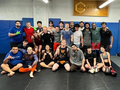 a group photo with a large group of smiling team members