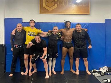 team members posing after wrestling