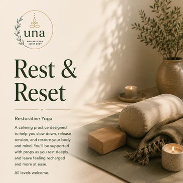 Yoga setup with candles and props for relaxation.