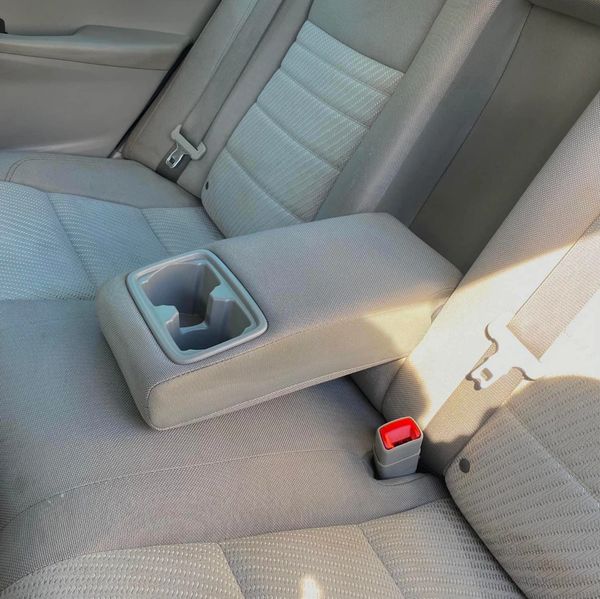 Deep cleaning  car carpet/seat shampoo eliminating dirt, odors, and stains for spotless interior. 