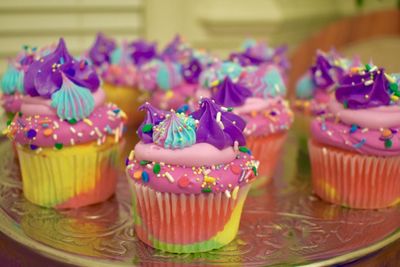 multi color troll themed cupcakes rainbow  sprinkle mix 