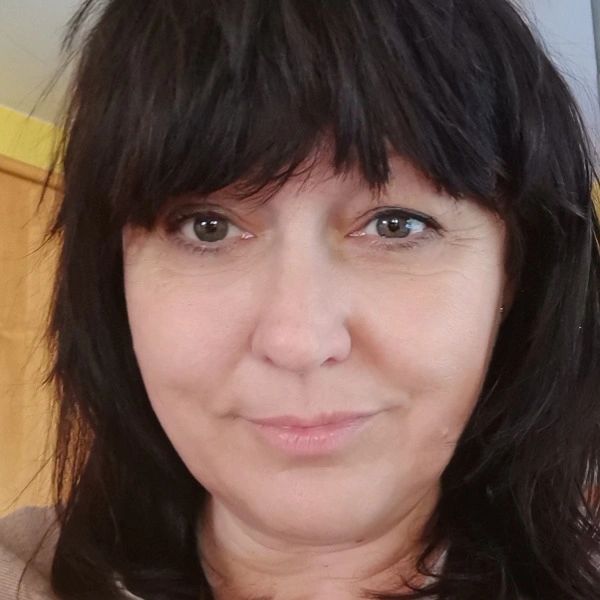 a smiling woman with black hair