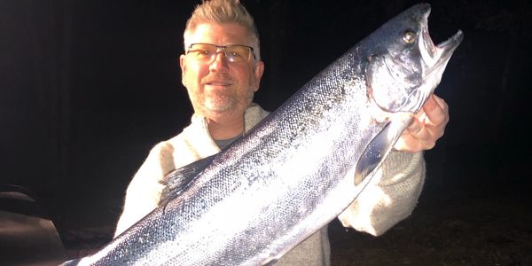 Captain Michael Haack from "Tackle Haack" Charters with huge Steelhead Trout 