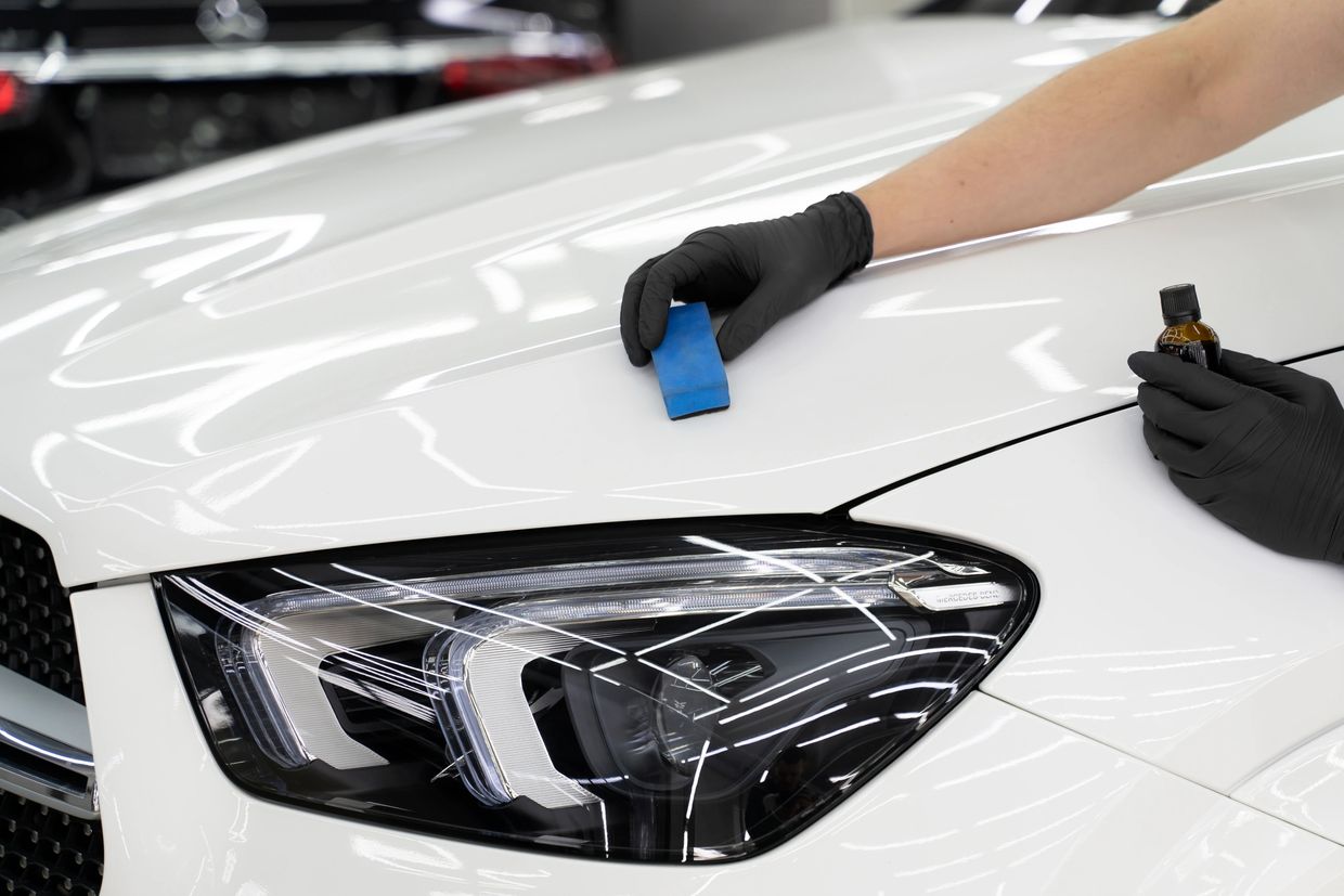 Applying a ceramic coating on a white car in Shawnee, Oklahoma