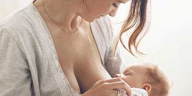 Mother breastfeeding her child