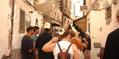 Group in  Essaouira’s markets for fresh produce, local crafts, and an authentic Moroccan experience.