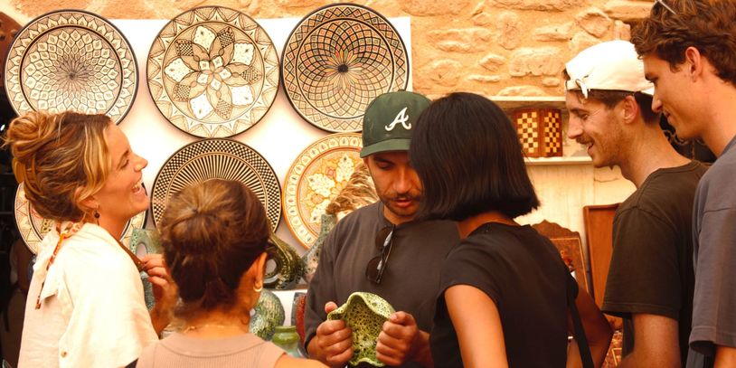 Group of people shopping in Essaouira’s medina, enjoying an authentic local shopping experience