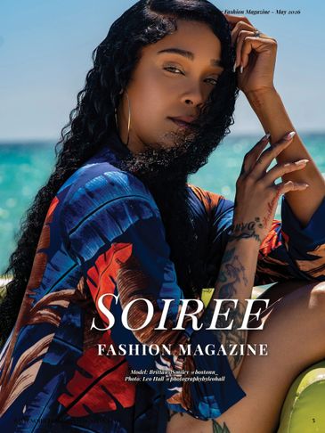 Woman posing by the ocean for Soiree Fashion Magazine cover.