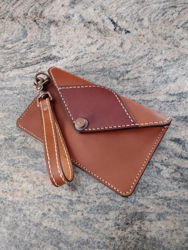 $120.00  leather lined Clutch Purse with 
               zipperd pocket. Bridle leather.
           