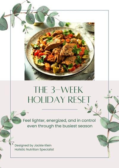 Warm dish of chicken and vegetables on a round plate with decorative eucalyptus around it.