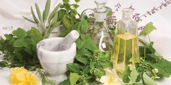 A picture of herbs with olive oil