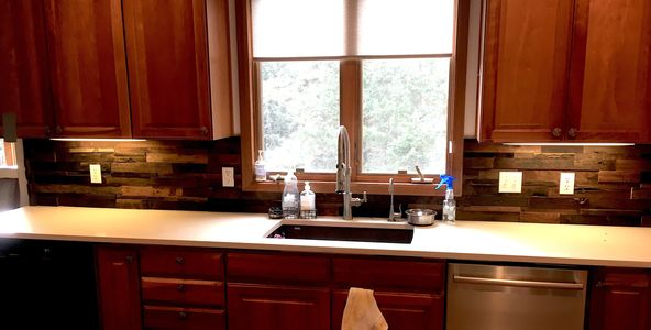 Recycled Chinese boat wood backsplash.