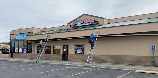 The Easy Rain Crew installing new gutters on a local Arctic Circle in Draper.