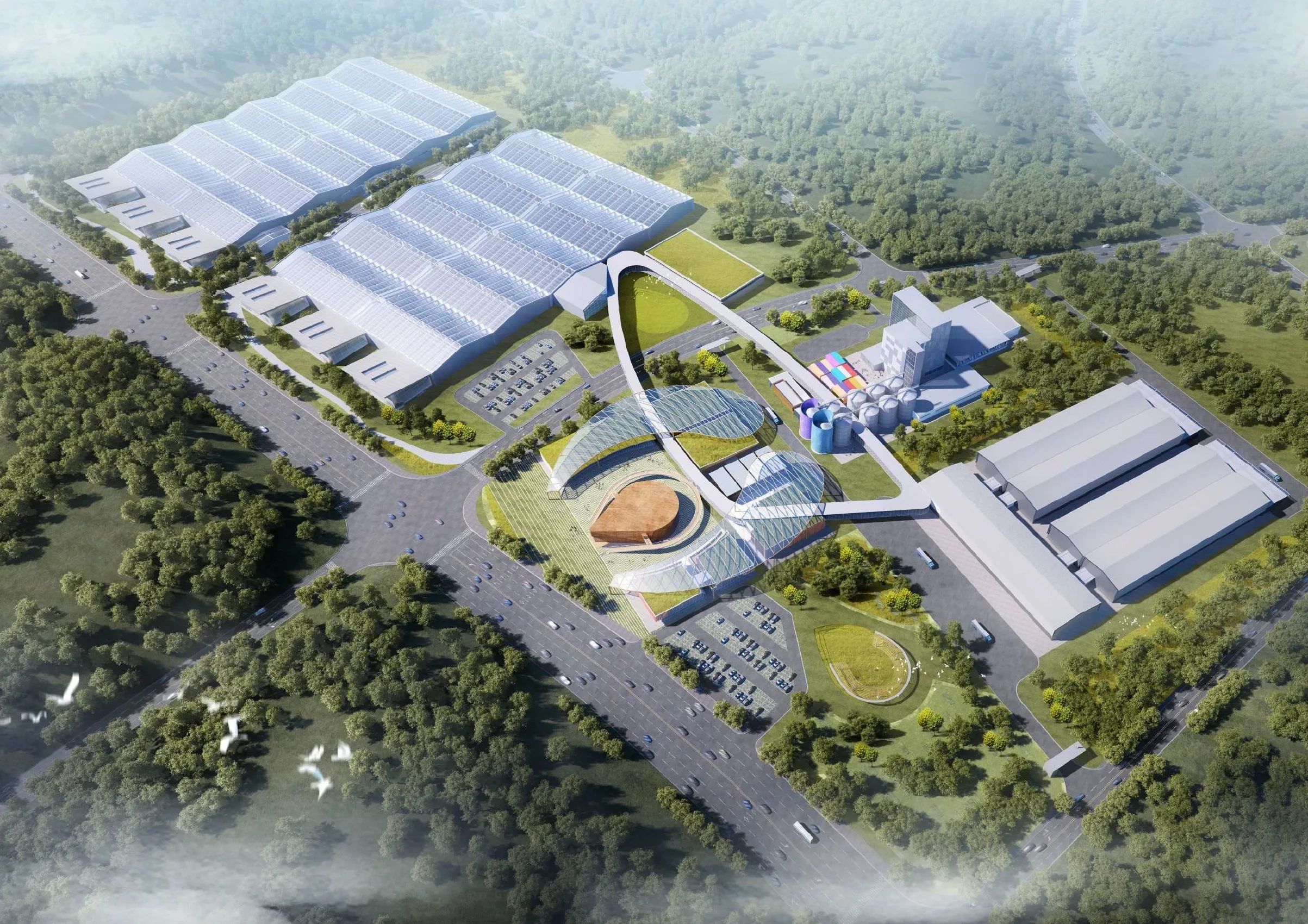 Aerial view of a modern industrial complex surrounded by greenery.