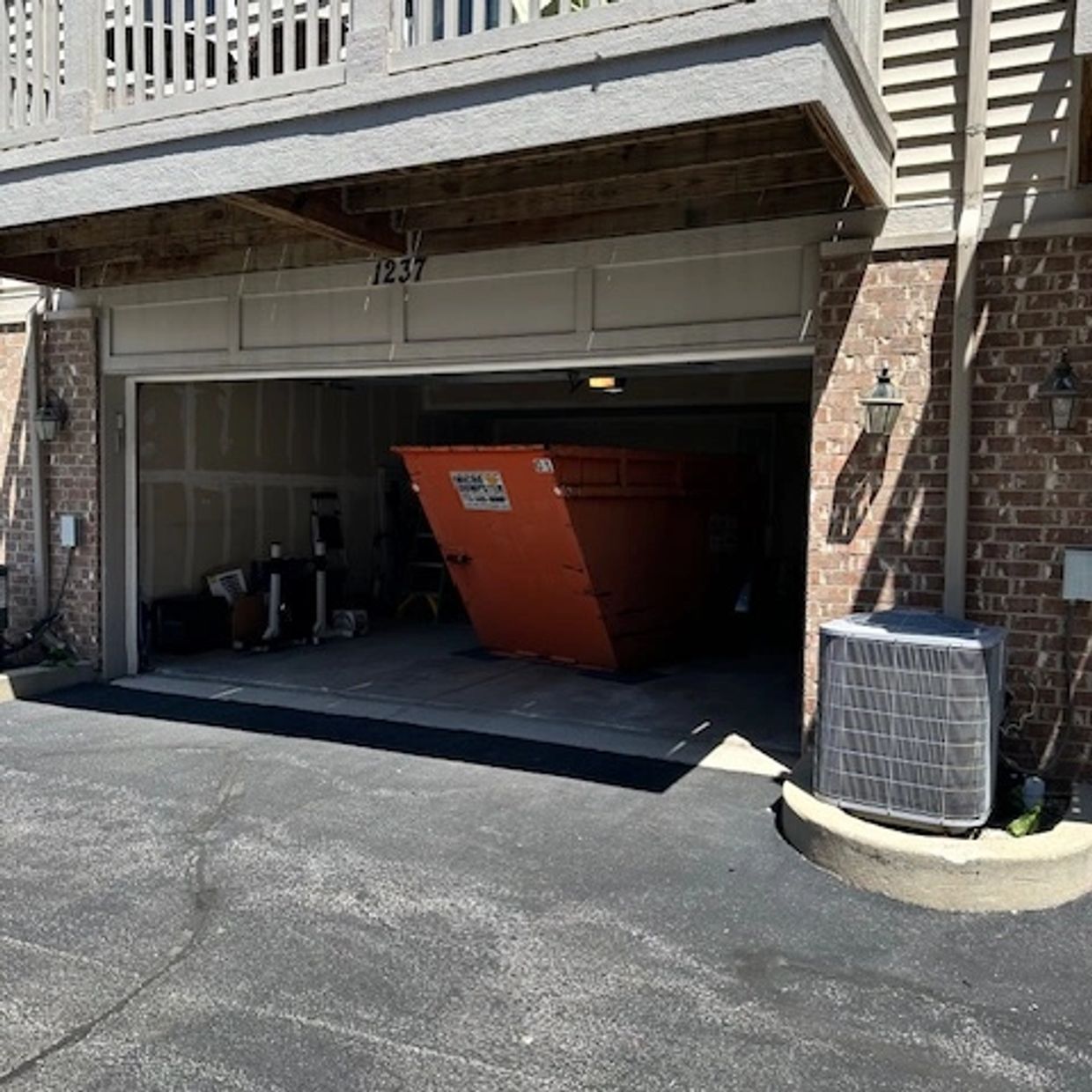 Micro Dumpster 7-yard JUNK Dumpster inside a Glenview townhome garage