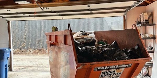 7-yard JUNK Dumpster inside a Glenview  garage